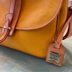 Dooney and Burke Yellow equestrian leather bag. Tan accents